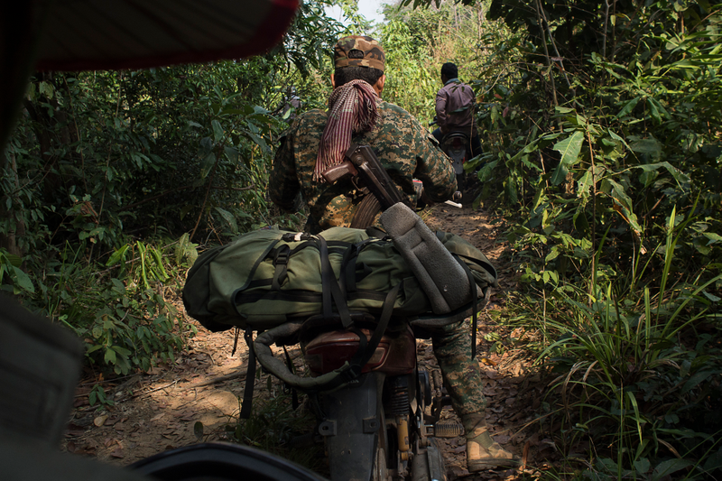A patrol of forestry activists from Prey Lang Community Network on the way into the core area of the forest. The activists use non-violence as a guiding principle, but are here accompanied by armed law enforcement officers to guarantee their safety.